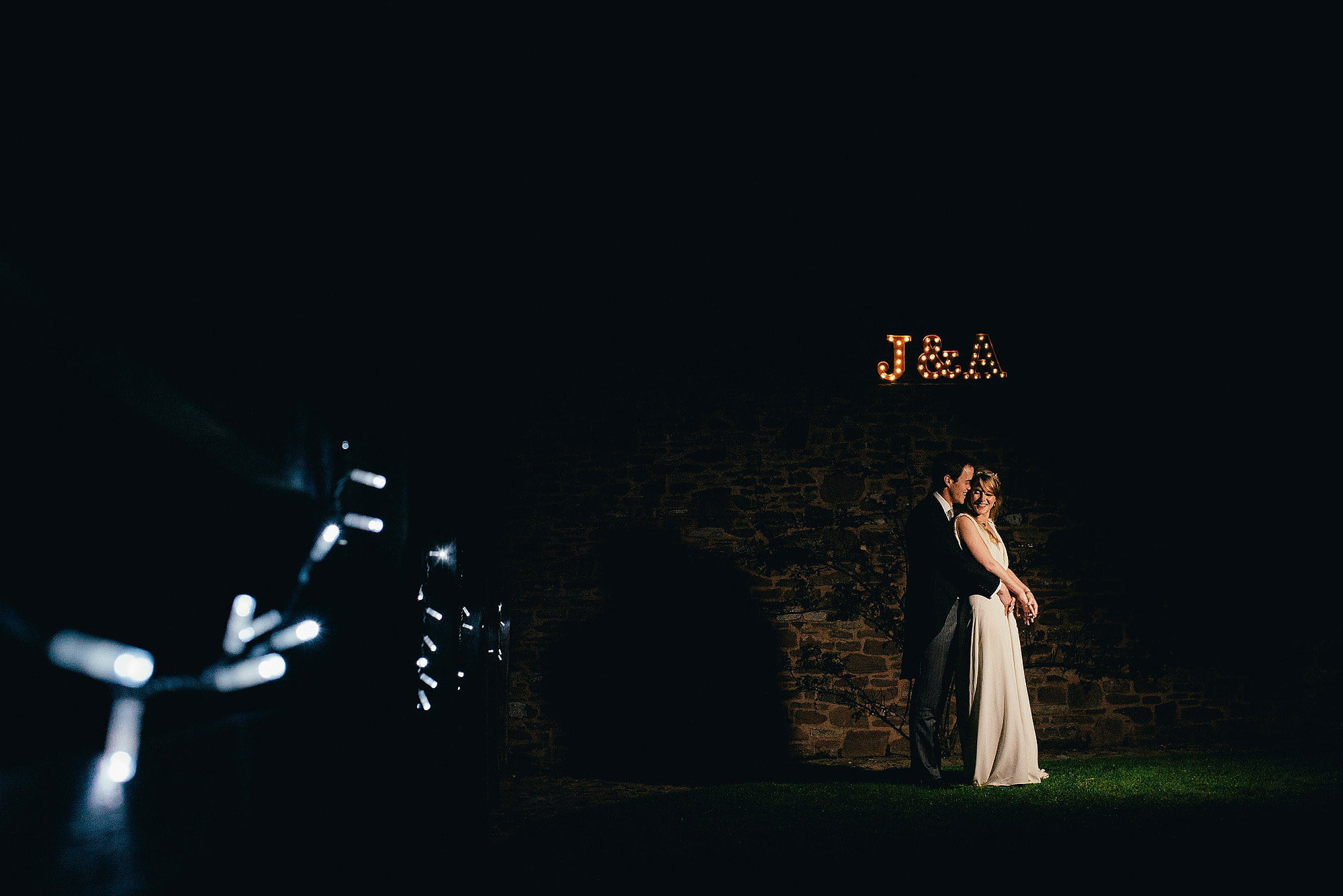 night time portrait for bride and groom fairy lights