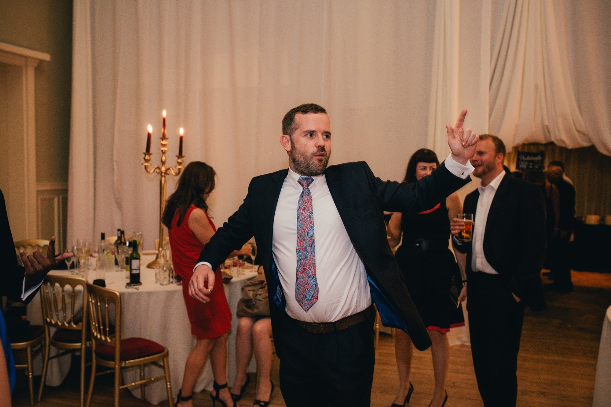 dancing male wedding guest