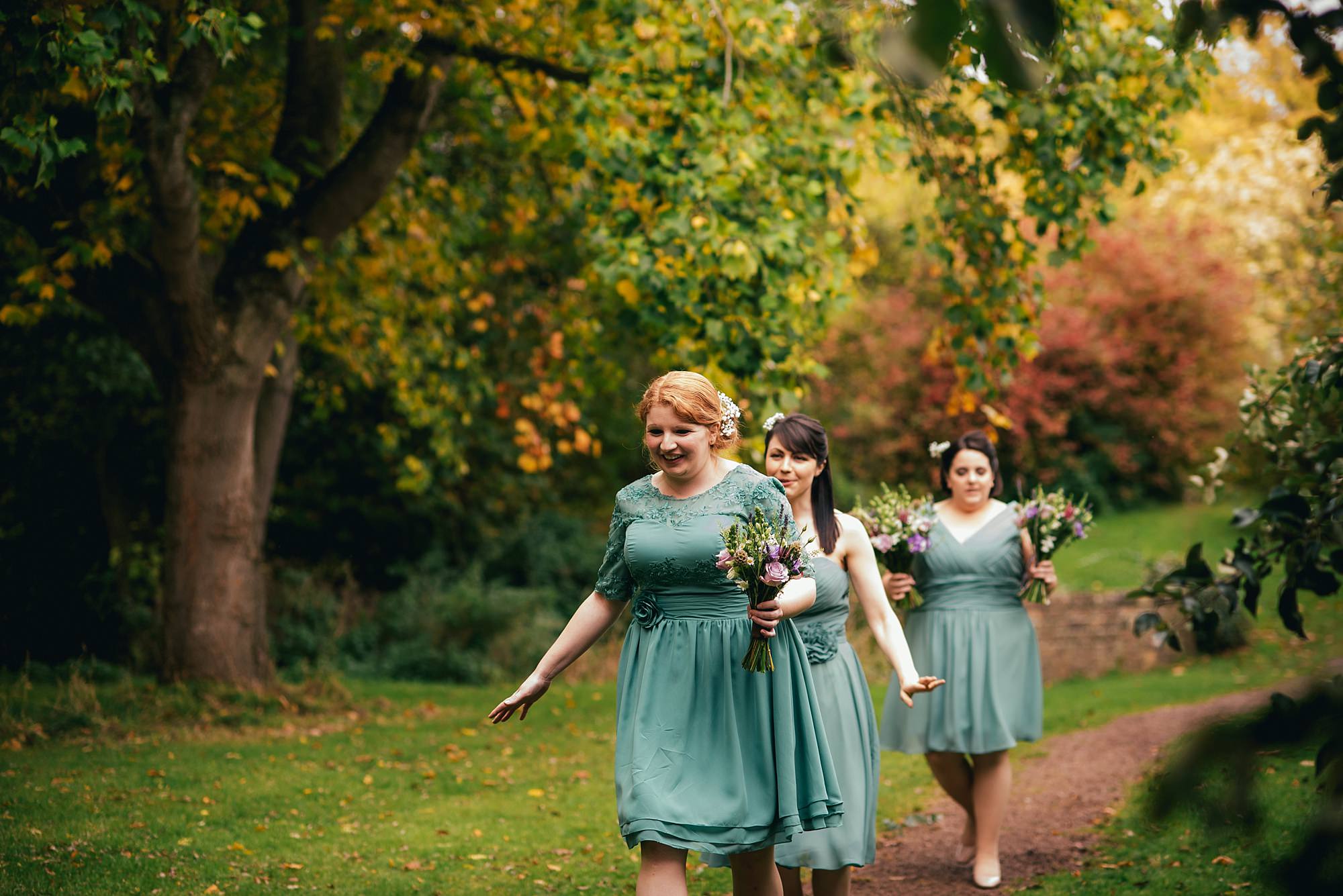 bridesmaids on church path at Dewsall Court